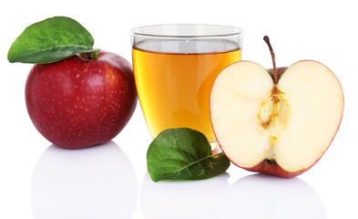 Glass of apple juice with red apples isolated on white