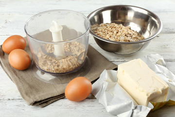 Ingredients for oatmeal cookies on wooden table, closeup