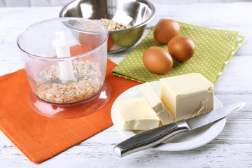 Ingredients for oatmeal cookies on wooden table, closeup