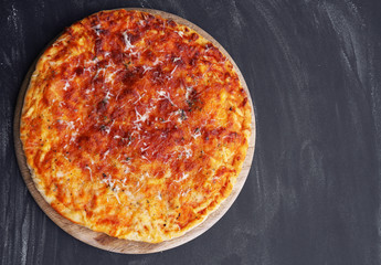 Cheese pizza on wooden table, closeup