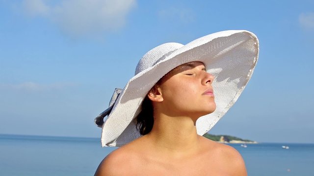 Beautiful carefree Latin American girl enjoying her beach lifestyle