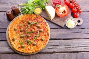 Pizza on wooden background