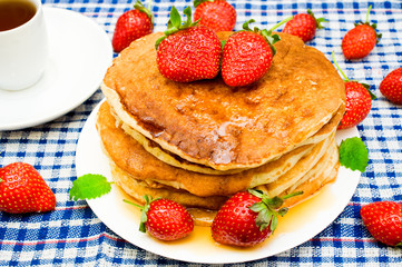 pancakes with strawberries and tea