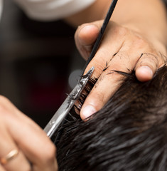 men's hair cutting scissors in a beauty salon