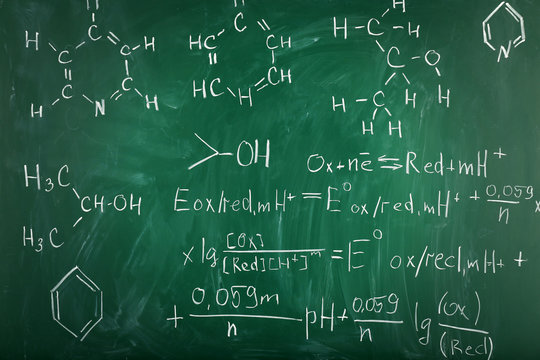 Molecule models and formulas on blackboard background
