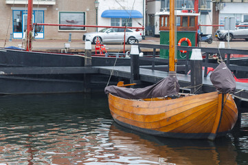 Fototapeta na wymiar Old fishing boat parked in fishing village of Urk, Netherlands