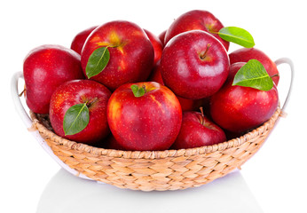 Fototapeta na wymiar Ripe red apple in wicker basket isolated on white