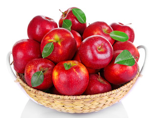 Naklejka na ściany i meble Ripe red apple in wicker basket isolated on white