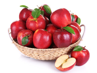 Naklejka na ściany i meble Ripe red apple in wicker basket isolated on white