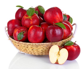 Fototapeta na wymiar Ripe red apple in wicker basket isolated on white