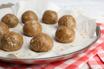 Raw dough for cookies on baking sheet close up
