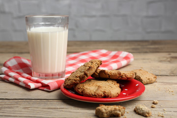 Homemade cookies and glass of milk on table close up