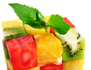 Sliced fruits with mint close up