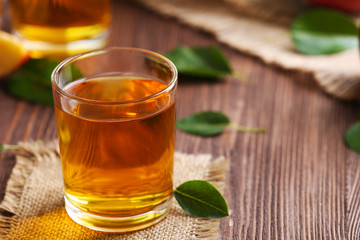 Glasses of apple juice on table close up