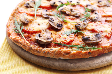 Tasty pizza with vegetables and napkin close up