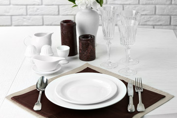 Beautiful table setting with candles close up