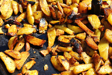 Frying pan with fried potatoes closeup