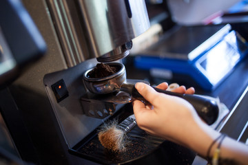 Closeup of barista grinding coffee, prepare to brewing espresso