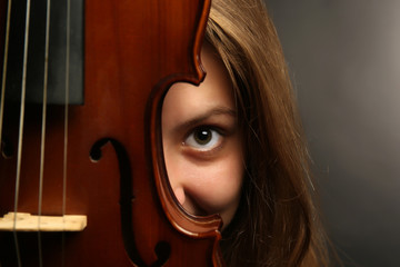 Female portrait with violin, closeup