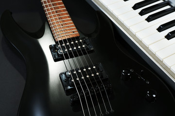 Synthesizer and electric guitar, closeup
