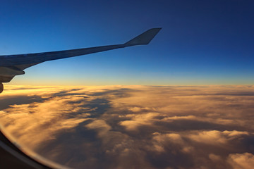 Fototapeta premium aircraft wing with cloudy
