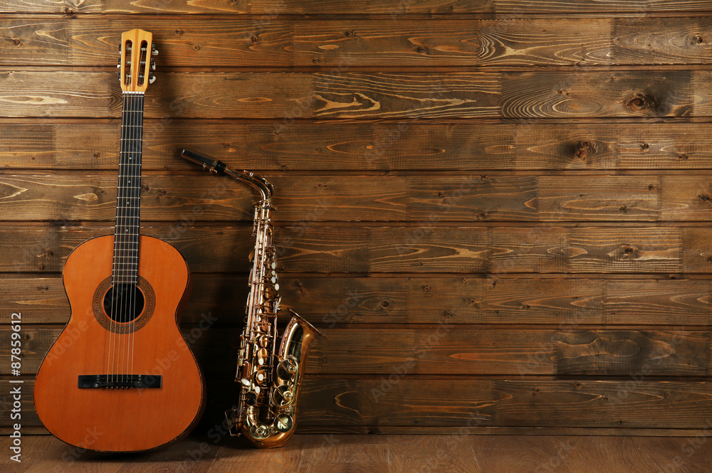 Sticker musical instruments on wooden planks background