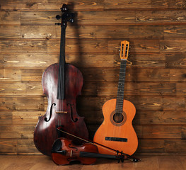 Musical instruments on wooden planks background