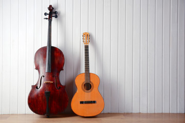 Musical instruments on wooden planks background