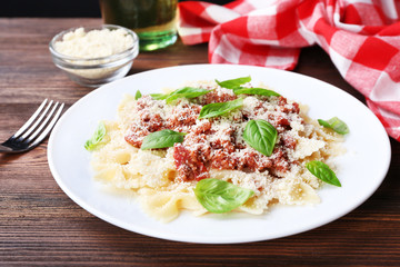 Pasta bolognese on wooden table, closeup