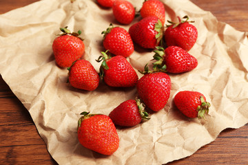 Ripe strawberries on crumples parchment, closeup