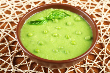 Tasty peas soup on table close up