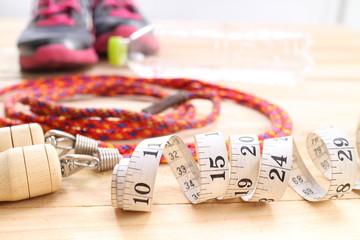 fitness equipment isolated on wood  background
