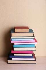 Stack of books on shelf.