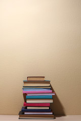 Stack of books on shelf.