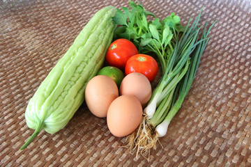 Thai vegetable and egg for cooking on bamboo weave