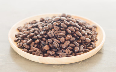 Roast coffee bean on wooden plate