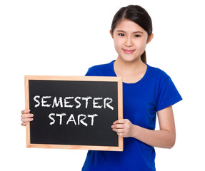 Asian student show with blackboard phrase semester start