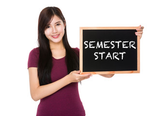 Asian woman hold with the blank chalkboard showing semester star © leungchopan