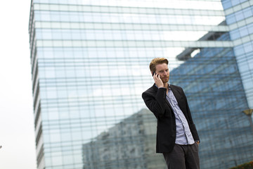 Young man on the street with mobile phone