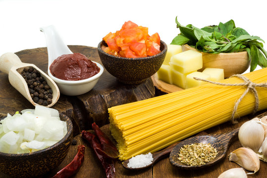 Raw spaghetti Ingredients on wooden table