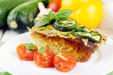 Casserole with vegetable mallow in white plate on table, closeup