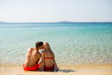 Young couple relaxing on the beach