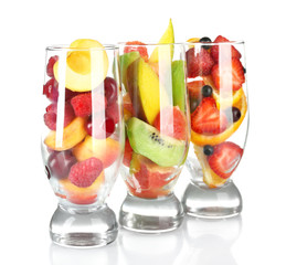 Glasses of berries and fruits isolated on white