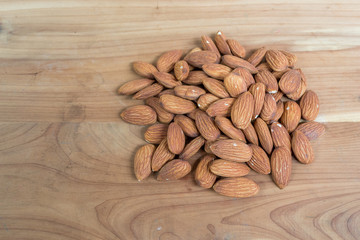 Almonds on wooden table
