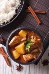Thai massaman curry with chicken and rice close-up. vertical top view
