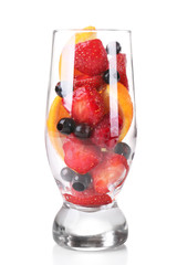 Fresh fruits salad in glass isolated on white