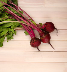 Young beets on wooden table
