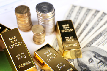 Gold bullion with money on table close up