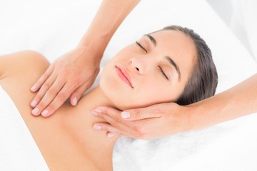Fototapeta na wymiar Attractive woman receiving head massage at spa center