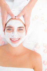 Attractive woman receiving treatment at spa center